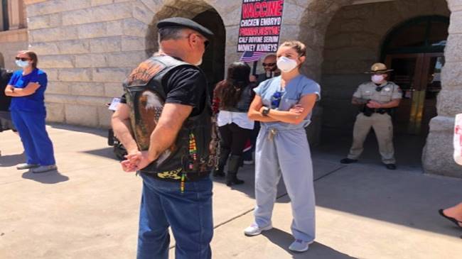 This photo shows a nurse facing down a protester in Arizona. Picture: Claudia Rupcich